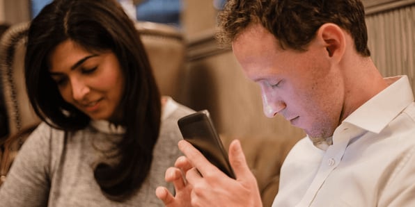 Visually impaired man using his smartphone accessibility assistance