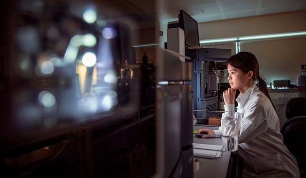 Scientist looking at computer screen in the lab