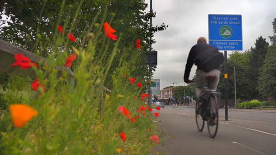 A cyclist about to enter Birminghams Clean Air Zone