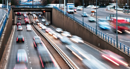 Blurred image of rush hour traffic on a dual carriageway